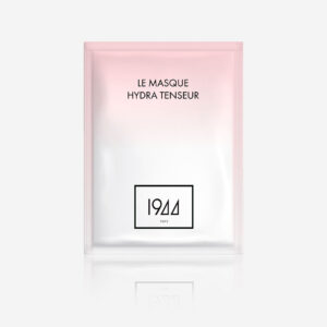 Le Masque Hydra Tenseur 1944 Paris face mask in a light pink sachet, presented on a minimalist grey background.
