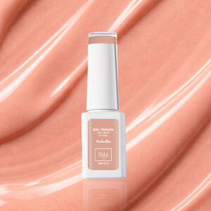 Bottle of Sabella NGV273 light peachy pink vegan gel nail varnish on a shiny peachy base.