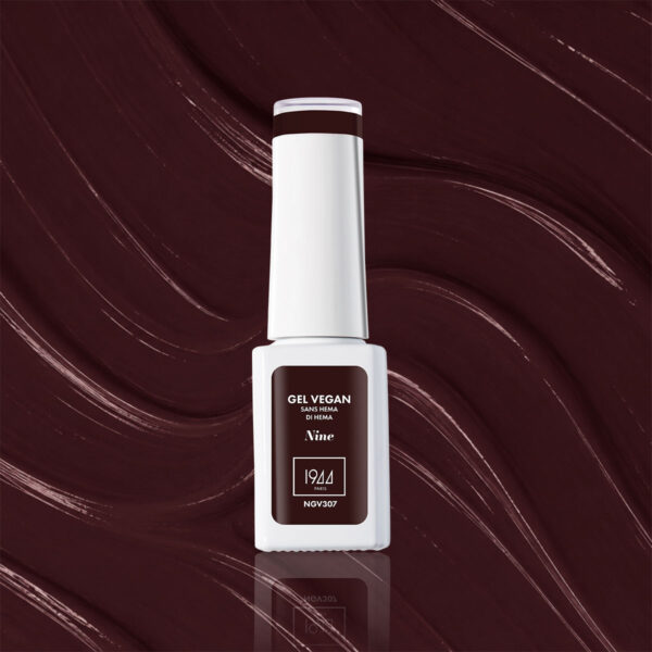 Flacon du Gel Vegan Nine 1944 Paris sur une texture bordeaux foncé.