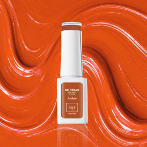Flacon du Gel Vegan Ambre 1944 Paris sur une texture orange brillante.
