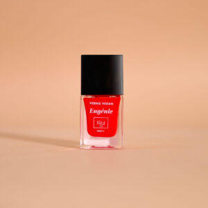 Vegan Eugénie bright red 1944 Paris nail varnish bottle on a peach background