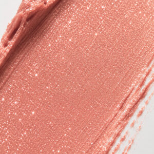 Textura en tono melocotón rosado con purpurina del stick Glow 1944 Paris