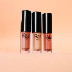 Three shades of 1944 Paris Matte Liquid Eyeshadow on a peach-coloured base.