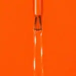 Liquid version of Roxane vegan nail varnish, bright orange shade (ref. 3VN295), 1944 Paris