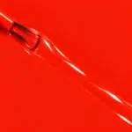 Liquid version of Evelyne vegan nail varnish, orange-red shade (ref. 3VN300), 1944 Paris