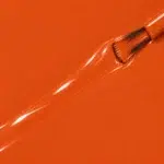 Liquid version of the vegan Ambre nail varnish, burnt orange shade (ref. 3VN309), 1944 Paris