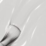 Liquid form of Lydie vegan semi-permanent nail varnish, pearl grey shade (ref. NGV101), 1944 Paris