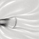 Liquid form of Louna vegan semi-permanent nail varnish, pearl grey shade (ref. NGV1209), 1944 Paris