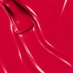 Liquid form of Cassandre vegan semi-permanent nail varnish, red shade (ref. NGV1212), 1944 Paris