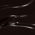 Liquid form of Bruna vegan semi-permanent nail varnish, dark brown shade (ref. NGV270), 1944 Paris